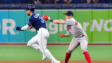 ST PETERSBURG, FLORIDA - JUNE 22: Enrique Hernandez #5 of the Boston Red Sox tags Kevin Kiermaier #39 of the Tampa Bay Rays out during the ninth inning at Tropicana Field on June 22, 2021 in St Petersburg, Florida. (Photo by Julio Aguilar/Getty Images)