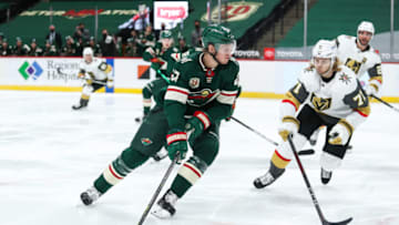 Mar 8, 2021; Saint Paul, Minnesota, USA; Minnesota Wild center Nick Bjugstad (27) skates with the puck while Vegas Golden Knights center William Karlsson (71) defends in the second period at Xcel Energy Center. Mandatory Credit: David Berding-USA TODAY Sports
