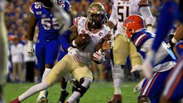 James Blackman #1 of the Florida State Seminoles scrambles during a game against the Florida Gators at Ben Hill Griffin Stadium on November 30, 2019 in Gainesville, Florida. (Photo by Mike Ehrmann/Getty Images)