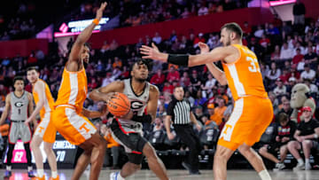 Mar 1, 2022; Athens, Georgia, USA; Georgia Bulldogs guard Kario Oquendo (3) tries to get between Tennessee Volunteers guard Josiah-Jordan James (30) and forward Uros Plavsic (33) during the second half at Stegeman Coliseum. Mandatory Credit: Dale Zanine-USA TODAY Sports