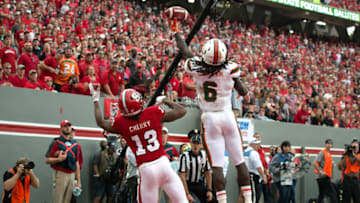 RALEIGH, NC - NOVEMBER 19: Jamal Carter, Sr. #6 of the Miami Hurricanes breaks up a pass intended for Bra'Lon Cherry #13 of the North Carolina State Wolfpack at Carter-Finley Stadium on November 19, 2016 in Raleigh, North Carolina. Miami won 27-13. (Photo by Lance King/Getty Images)