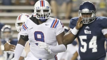Oct 30, 2015; Houston, TX, USA; Rice Owls quarterback Driphus Jackson (6) is sacked by Louisiana Tech Bulldogs defensive tackle Vernon Butler (9) in the first quarter at Rice Stadium. Mandatory Credit: Thomas B. Shea-USA TODAY Sports