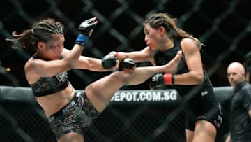 SINGAPORE - MAY 06: Angela Lee of Singapore (R) fights Mei Yamaguchi of Japan for the women's atomweight world championship during One Championship: Ascent to Power at Singapore Indoor Stadium on May 6, 2016 in Singapore. (Photo by Suhaimi Abdullah/Getty Images)