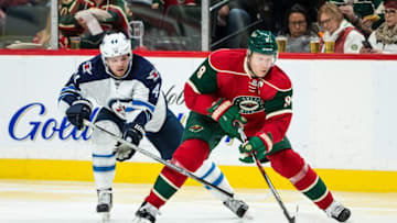 Nov 23, 2016; Saint Paul, MN, USA; Minnesota Wild forward Mikko Koivu (9) protects the puck from Winnipeg Jets defenseman Josh Morrissey (44) during the second period at Xcel Energy Center. Mandatory Credit: Brace Hemmelgarn-USA TODAY Sports