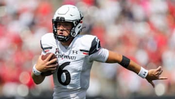 Cincinnati Bearcats quarterback Ben Bryant runs against the Miami Redhawks at Paycor Stadium. USA Today.