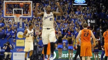 Jan 18, 2014; Lawrence, KS, USA; Kansas Jayhawks center Joel Embiid (21) celebrates after the game against the Oklahoma State Cowboys at Allen Fieldhouse. Kansas won 80-78. Mandatory Credit: John Rieger-USA TODAY Sports