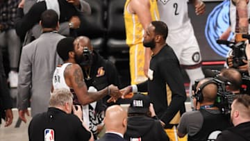 NEW YORK, NEW YORK - JANUARY 23: LeBron James #23 of the Los Angeles Lakers with Kyrie Irving #11 after the game against the Brooklyn Nets at Barclays Center on January 23, 2020 in New York City. NOTE TO USER: User expressly acknowledges and agrees that, by downloading and or using this photograph, User is consenting to the terms and conditions of the Getty Images License Agreement. (Photo by Matteo Marchi/Getty Images)