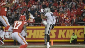 Jan 3, 2016; Kansas City, MO, USA; Kansas City Chiefs linebacker D.J. Alexander (57) blocks the punt of Oakland Raiders punter Marquette King (7) during the second half at Arrowhead Stadium. The Chiefs won 23-17. Mandatory Credit: Denny Medley-USA TODAY Sports