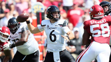 Cincinnati Bearcats quarterback Ben Bryant passes against the Arkansas Razorbacks. USA Today.