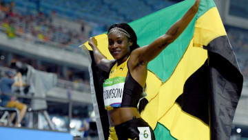 RIO DE JANEIRO, BRAZIL - AUGUST 17: Elaine Thompson of Jamaica celebrates after winning the gold medal in the Women's 200m Final on Day 12 of the Rio 2016 Olympic Games at the Olympic Stadium on August 17, 2016 in Rio de Janeiro, Brazil. (Photo by Matthias Hangst/Getty Images)