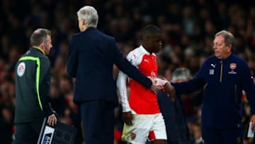 LONDON, ENGLAND - JANUARY 24: Arsene Wenger, Manager of Arsenal consoles Joel Campbell of Arsenal as he is substituted during the Barclays Premier League match between Arsenal and Chelsea at Emirates Stadium on January 24, 2016 in London, England. (Photo by Clive Mason/Getty Images)