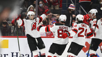 New Jersey Devils center Nico Hischier (13) reacts after scoring the game winning goal against the Washington Capitals during the overtime period at Capital One Arena. Mandatory Credit: Brad Mills-USA TODAY Sports