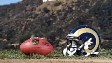 Feb 16, 2016; Los Angeles, CA, USA; General view of Los Angeles Rams helmet and NFL Wilson Duke football at Griffith Park with the Hollywood sign as a backdrop. NFL owners voted 30-2 to allow owner Stan Kroenke (not pictured) to move the St. Louis Rams to Los Angeles for the 2016 season. Mandatory Credit: Kirby Lee-USA TODAY Sports