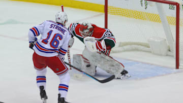 Mar 6, 2021; Newark, New Jersey, USA; New Jersey Devils goaltender Mackenzie Blackwood (29) makes a save on New York Rangers center Ryan Strome (16) during the first period at Prudential Center. Mandatory Credit: Ed Mulholland-USA TODAY Sports