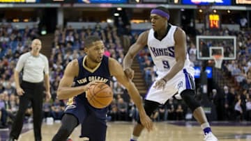 Jan 13, 2016; Sacramento, CA, USA; New Orleans Pelicans guard Eric Gordon (10) drives against Sacramento Kings guard Rajon Rondo (9) at Sleep Train Arena. Mandatory Credit: Kelley L Cox-USA TODAY Sports