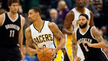 Mar 21, 2015; Indianapolis, IN, USA; Indiana Pacers guard George Hill (3) dribbles past Brooklyn Nets guard Deron Williams (8) in the second quarter of the game at Bankers Life Fieldhouse. Mandatory Credit: Trevor Ruszkowski-USA TODAY Sports