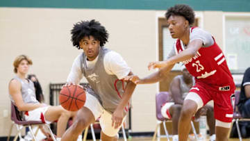 Skyy Clark (30) drives the ball past TaDarius Jacobs (23) on Wednesday, July 8, 2020, during Hoop City Pro Week at First Assembly Christian School in Cordova.