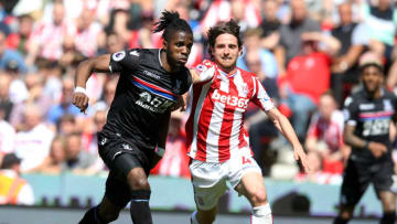 STOKE ON TRENT, ENGLAND - MAY 05: Wilfried Zaha of Crystal Palace and Joe Allen of Stoke City battle for the ball during the Premier League match between Stoke City and Crystal Palace at Bet365 Stadium on May 5, 2018 in Stoke on Trent, England. (Photo by Nigel Roddis/Getty Images)