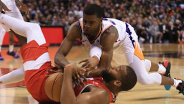 TORONTO, ON- Toronto Raptors Greg Monroe gets tackled by Phoenix Suns Josh Jackson( top right) in NBA action (Rene Johnston Toronto Star) (Rene Johnston/Toronto Star via Getty Images)