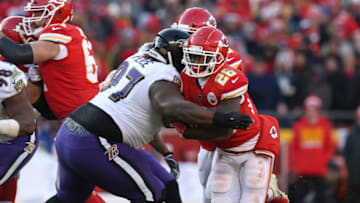 KANSAS CITY, MO - DECEMBER 09: Baltimore Ravens defensive tackle Michael Pierce (97) tackles Kansas City Chiefs running back Damien Williams (26) short of the first down in the third quarter of an NFL game between the Baltimore Ravens and Kansas City Chiefs on December 9, 2018 at Arrowhead Stadium in Kansas City, MO. (Photo by Scott Winters/Icon Sportswire via Getty Images)