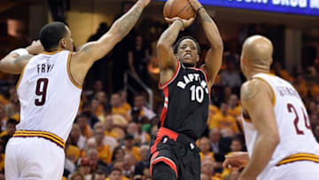 May 17, 2016; Cleveland, OH, USA; Toronto Raptors guard DeMar DeRozan (10) shoots between Cleveland Cavaliers forward Channing Frye (9) and Cleveland Cavaliers forward Richard Jefferson (24) during the second quarter in game one of the Eastern conference finals of the NBA Playoffs at Quicken Loans Arena. Mandatory Credit: Ken Blaze-USA TODAY Sports