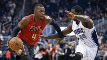 Dec 20, 2015; Orlando, FL, USA; Atlanta Hawks forward Paul Millsap (4) drives around Orlando Magic forward Andrew Nicholson (44) during the first quarter of a basketball game at Amway Center. Mandatory Credit: Reinhold Matay-USA TODAY Sports