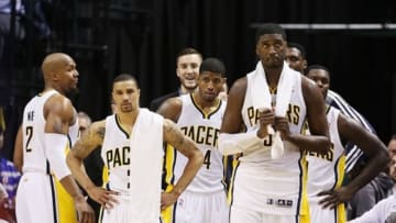 Apr 21, 2013; Indianapolis, IN, USA; Indiana Pacers starting five (L-R) forward David West (21), guard George Hill (3), forward Paul George (24), center Roy Hibbert (55), and guard Lance Stephenson (1) watch from the bench against the Atlanta Hawks during game one of the first round of the 2013 NBA Playoffs at Bankers Life Fieldhouse. Indiana defeats Atlanta 107-90. Mandatory Credit: Brian Spurlock-USA TODAY Sports