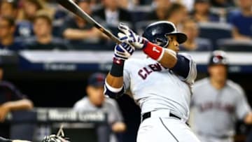 Aug 21, 2015; Bronx, NY, USA; Cleveland Indians first baseman Carlos Santana (41) hits a solo home run against the New York Yankees in the sixth inning at Yankee Stadium. Mandatory Credit: Andy Marlin-USA TODAY Sports