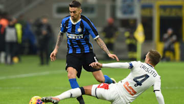MILAN, ITALY - DECEMBER 21: Matias Vecino of FC Internazionale challenged by Domenico Criscito of Genoa CFC during the Serie A match between FC Internazionale and Genoa CFC at Stadio Giuseppe Meazza on December 21, 2019 in Milan, Italy. (Photo by Chris Ricco/Getty Images)