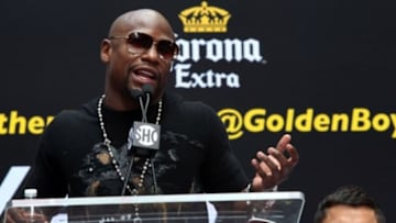 Jul 14, 2014; New York, NY, USA; Floyd Mayweather Jr. and Marcos Maidana (right) promote their upcoming welterweight rematch during a press conference at Times Square. Mandatory Credit: Noah K. Murray-USA TODAY Sports