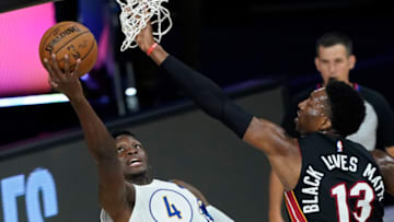 LAKE BUENA VISTA, FLORIDA - AUGUST 24: Victor Oladipo #4 of the Indiana Pacers shoots around Bam Adebayo #13 of the Miami Heat during the first half of a first round playoff game at The Field House at ESPN Wide World Of Sports Complex on August 24, 2020 in Lake Buena Vista, Florida. NOTE TO USER: User expressly acknowledges and agrees that, by downloading and or using this photograph, User is consenting to the terms and conditions of the Getty Images License Agreement. (Photo by Ashley Landis-Pool/Getty Images)
