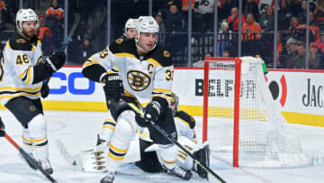 PHILADELPHIA, PA - JANUARY 13: Zdeno Chara #33 of the Boston Bruins, who is playing in his 1000th game, tries to clear the puck during the game against the Philadelphia Flyers in the third period at Wells Fargo Center on January 13, 2020 in Philadelphia, Pennsylvania. The Flyers won 6-5 in a shootout. (Photo by Drew Hallowell/Getty Images)