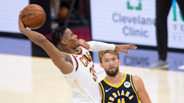 Dec 12, 2020; Cleveland, Ohio, USA; Cleveland Cavaliers guard Isaac Okoro (35) drives to the basket against Indiana Pacers forward Domantas Sabonis (11) during the third quarter at Rocket Mortgage FieldHouse. Mandatory Credit: Ken Blaze-USA TODAY Sports