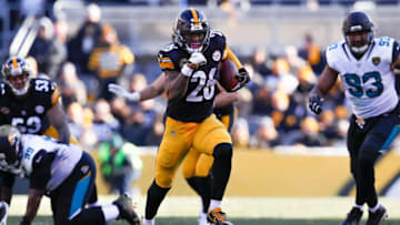 PITTSBURGH, PA - JANUARY 14: Le'Veon Bell #26 of the Pittsburgh Steelers runs with the ball against the Jacksonville Jaguars during the first half of the AFC Divisional Playoff game at Heinz Field on January 14, 2018 in Pittsburgh, Pennsylvania. (Photo by Kevin C. Cox/Getty Images)