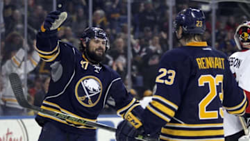 Mar 18, 2016; Buffalo, NY, USA; Buffalo Sabres defenseman Zach Bogosian (47) celebrates his goal during the second period with Buffalo Sabres center Sam Reinhart (23) against the Ottawa Senators at First Niagara Center. Mandatory Credit: Timothy T. Ludwig-USA TODAY Sports