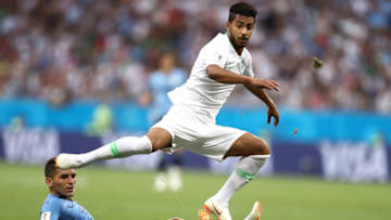 ROSTOV-ON-DON, RUSSIA - JUNE 20: Hussain Almoqahwi of Saudi Arabia is tackled by Lucas Torreira of Uruguay during the 2018 FIFA World Cup Russia group A match between Uruguay and Saudi Arabia at Rostov Arena on June 20, 2018 in Rostov-on-Don, Russia. (Photo by Ryan Pierse/Getty Images)