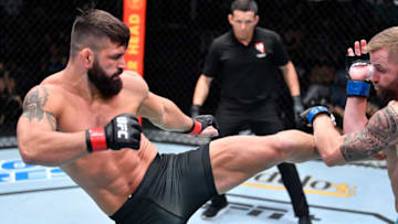 LAS VEGAS, NEVADA - AUGUST 28: (L-R) Andre Petroski kicks Michael Gillmore in a middleweight fight during the UFC Fight Night event at UFC APEX on August 28, 2021 in Las Vegas, Nevada. (Photo by Chris Unger/Zuffa LLC)