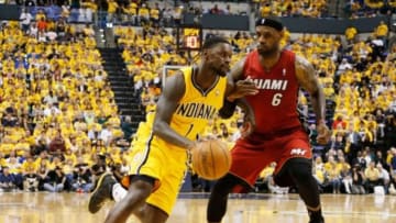 May 18, 2014; Indianapolis, IN, USA; Indiana Pacers guard Lance Stephenson (1) drives to the basket against Miami Heat forward LeBron James (6) in game one of the Eastern Conference Finals of the 2014 NBA Playoffs at Bankers Life Fieldhouse. Indiana defeats Miami 107-96. Mandatory Credit: Brian Spurlock-USA TODAY Sports