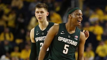 ANN ARBOR, MICHIGAN - FEBRUARY 24: Cassius Winston #5 and Matt McQuaid #20 of the Michigan State Spartans react after a basket late in the game while playing the Michigan Wolverines at Crisler Arena on February 24, 2019 in Ann Arbor, Michigan. Michigan State won the game 77-70. (Photo by Gregory Shamus/Getty Images)