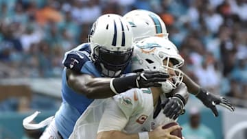Oct 9, 2016; Miami Gardens, FL, USA; Tennessee Titans outside linebacker Brian Orakpo (98) sacked Miami Dolphins quarterback Ryan Tannehill (17) during the second half at Hard Rock Stadium. Titans won 30-17. Mandatory Credit: Steve Mitchell-USA TODAY Sports