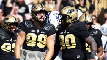 Auburn footballSep 10, 2022; West Lafayette, Indiana, USA; Purdue Boilermakers defensive end Jack Sullivan (99) and Purdue Boilermakers defensive tackle Lawrence Johnson (90) celebrate after a sack during the first quarter against the Indiana State Sycamores at Ross-Ade Stadium. Mandatory Credit: Robert Goddin-USA TODAY Sports