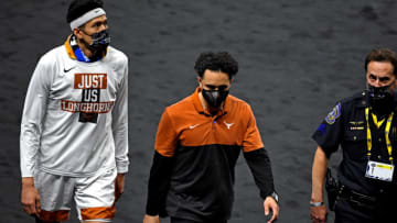 Mar 20, 2021; Indianapolis, Indiana, USA; Texas Longhorns head coach Shaka Smart walks off the court after losing to the Abilene Christian Wildcats in the first round of the 2021 NCAA Tournament at Lucas Oil Stadium. Mandatory Credit: Christopher Hanewinckel-USA TODAY Sports