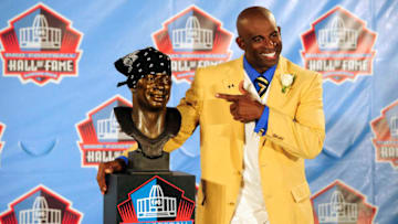 CANTON, OH - AUGUST 6: Former Atlanta Falcons cornerback Deion Sanders poses with his bust at the Enshrinement Ceremony for the Pro Football Hall of Fame on August 6, 2011 in Canton, Ohio. (Photo by Jason Miller/Getty Images)