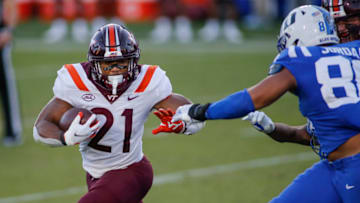 Oct 3, 2020; Durham, North Carolina, USA; Virginia Tech Hokies running back Khalil Herbert (21) carries the football against the Duke Blue Devils in the second half at Wallace Wade Stadium. The Virginia Tech Hokies won 38-31. Mandatory Credit: Nell Redmond-USA TODAY Sports