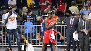 OAKLAND, CA - JUNE 13: Kawhi Leonard #2 high-fives Nick Nurse of the Toronto Raptors during trophy ceremony after the game during Game Six of the NBA Finals on June 13, 2019 at ORACLE Arena in Oakland, California. NOTE TO USER: User expressly acknowledges and agrees that, by downloading and/or using this photograph, user is consenting to the terms and conditions of Getty Images License Agreement. Mandatory Copyright Notice: Copyright 2019 NBAE (Photo by Noah Graham/NBAE via Getty Images)