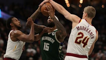 MILWAUKEE, WISCONSIN - DECEMBER 06: DeMarcus Cousins #15 of the Milwaukee Bucks drives to the basket against Evan Mobley #4 and Lauri Markkanen #24 of the Cleveland Cavaliers during a game at Fiserv Forum on December 06, 2021 in Milwaukee, Wisconsin. NOTE TO USER: User expressly acknowledges and agrees that, by downloading and or using this photograph, User is consenting to the terms and conditions of the Getty Images License Agreement. (Photo by Stacy Revere/Getty Images)