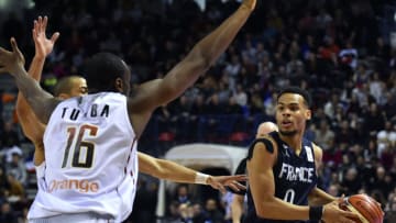 France's Elie Okobo (R) is challenged by Belgium's Kevin Tumba during the FIBA Basketball World Cup 2019 qualifying match between France and Belgium at the Palais des Sports Jean Weille in Nancy, eastern France, on February 25, 2018. / AFP PHOTO / JEAN-CHRISTOPHE VERHAEGEN (Photo credit should read JEAN-CHRISTOPHE VERHAEGEN/AFP/Getty Images)