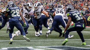 SEATTLE, WA - OCTOBER 07: Running Back Todd Gurley III #30 of the Los Angeles Rams scores a touchdown during the second half against the Seattle Seahawks at CenturyLink Field on October 7, 2018 in Seattle, Washington. (Photo by Otto Greule Jr/Getty Images)
