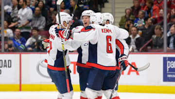 VANCOUVER, BC - OCTOBER 25: Lars Eller #20 of the Washington Capitals is congratulated by teammates after scoring during their NHL game at Rogers Arena October 25, 2019 in Vancouver, British Columbia, Canada. (Photo by Derek Cain/NHLI via Getty Images)