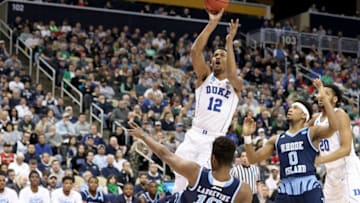 PITTSBURGH, PA - MARCH 17: Javin DeLaurier #12 of the Duke Blue Devils shoots the ball against Cyril Langevine #10 of the Rhode Island Rams during the first half in the second round of the 2018 NCAA Men's Basketball Tournament at PPG PAINTS Arena on March 17, 2018 in Pittsburgh, Pennsylvania. (Photo by Rob Carr/Getty Images)